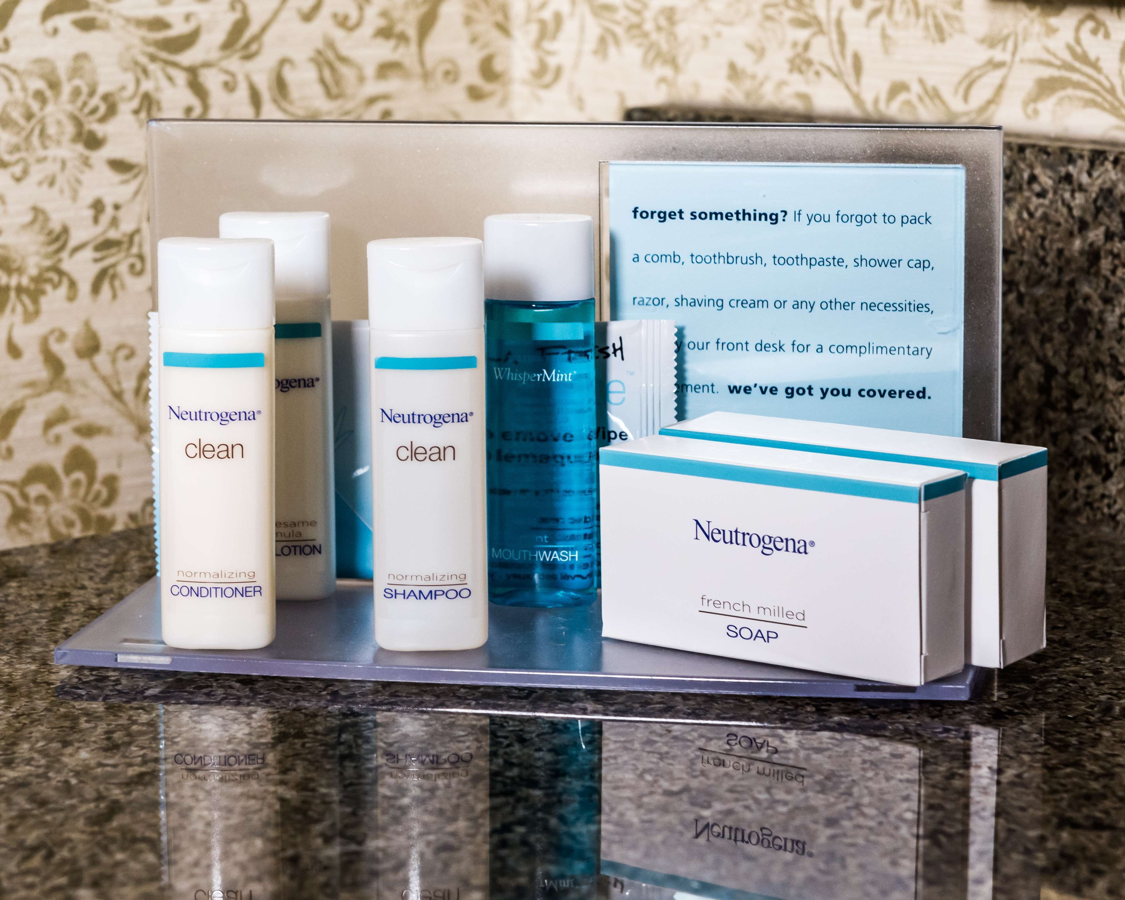 designer toiletries, hair dryer, towels