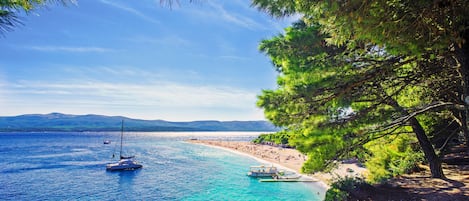 Beach nearby, white sand, beach volleyball