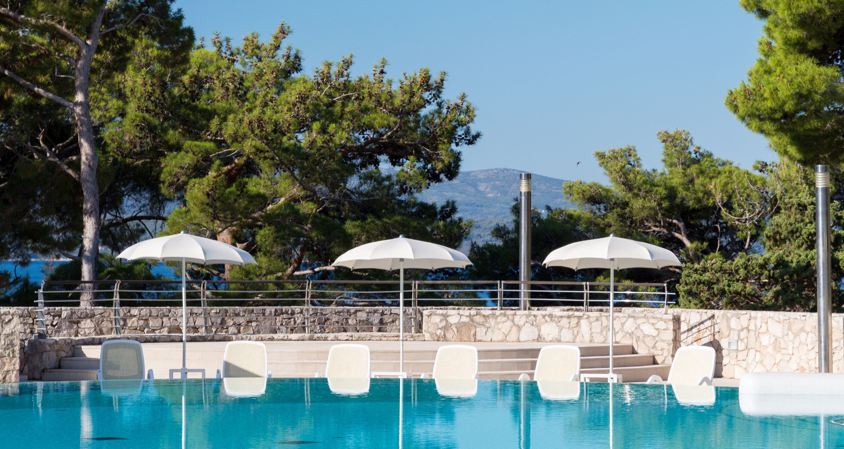 indoor pool, outdoor pool, pool umbrellas, pool loungers