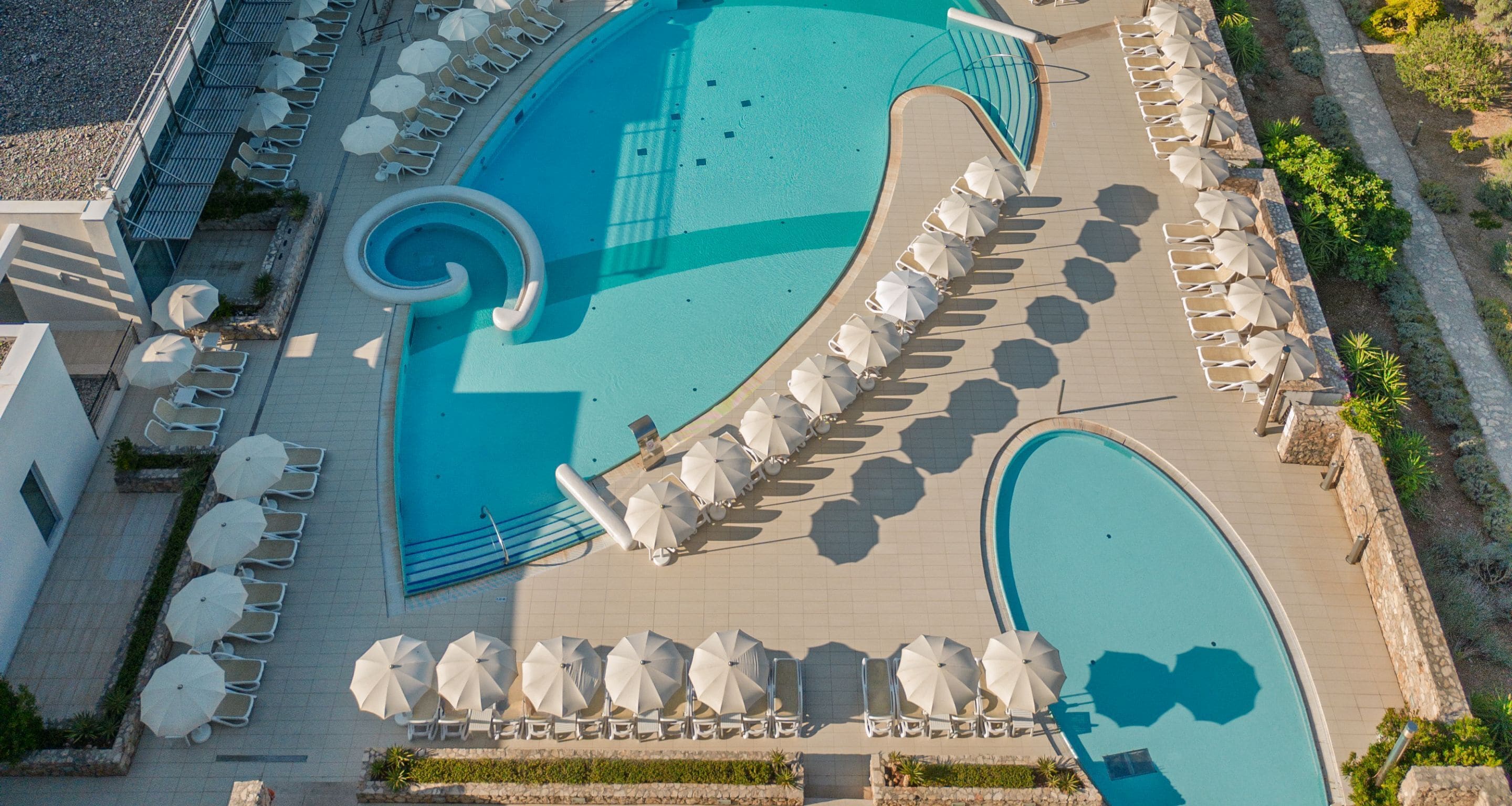 Indoor pool, outdoor pool, pool umbrellas, pool loungers