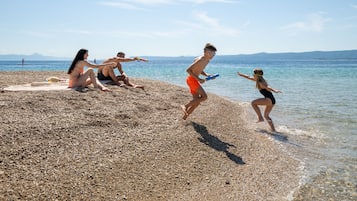 Beach nearby, white sand, beach volleyball