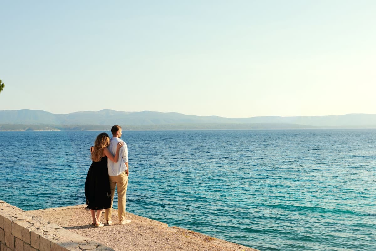 beach nearby, white sand, beach volleyball