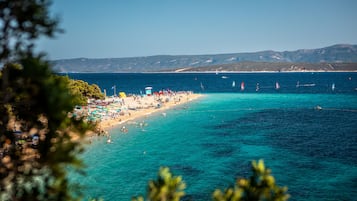 Beach nearby, white sand, beach volleyball