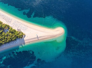 Beach nearby, white sand, beach volleyball
