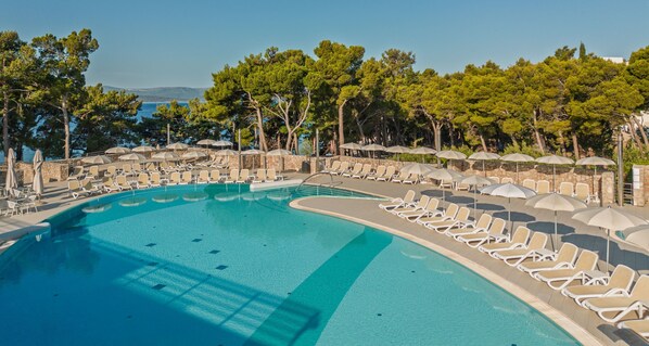 Indoor pool, outdoor pool, pool umbrellas, pool loungers