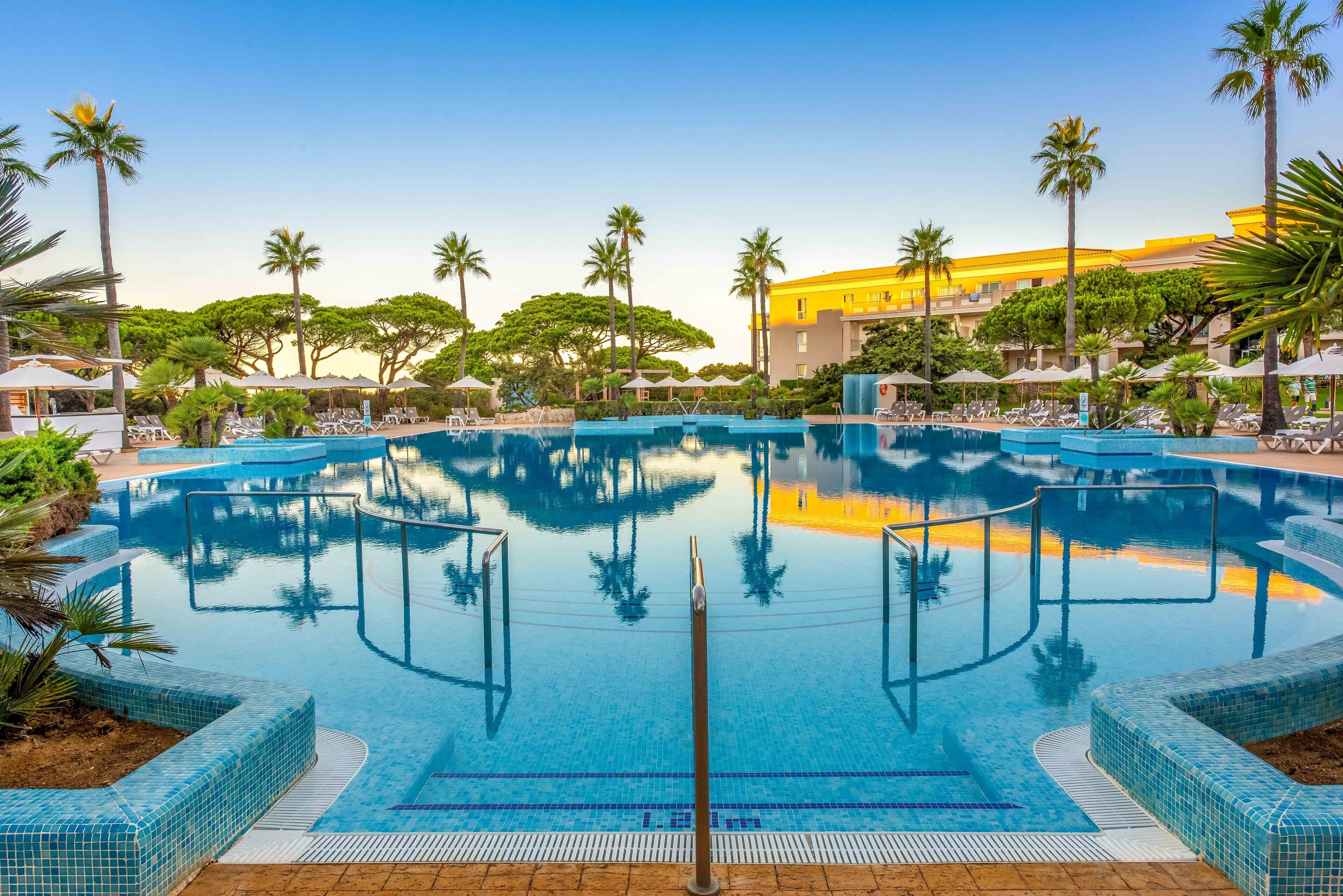 indoor pool, 2 outdoor pools, open 11:00 am to 7:00 pm, pool umbrellas