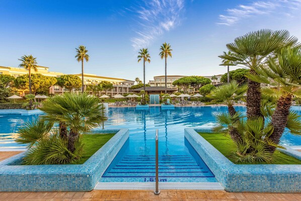 Indoor pool, 2 outdoor pools, open 11:00 AM to 7:00 PM, pool umbrellas