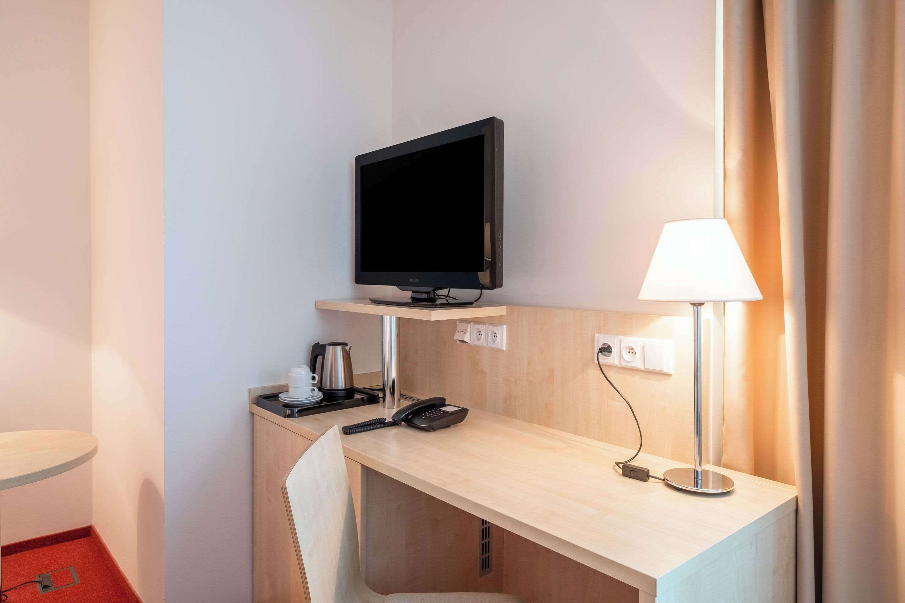 standard double room | in-room safe, desk, laptop workspace, blackout curtains