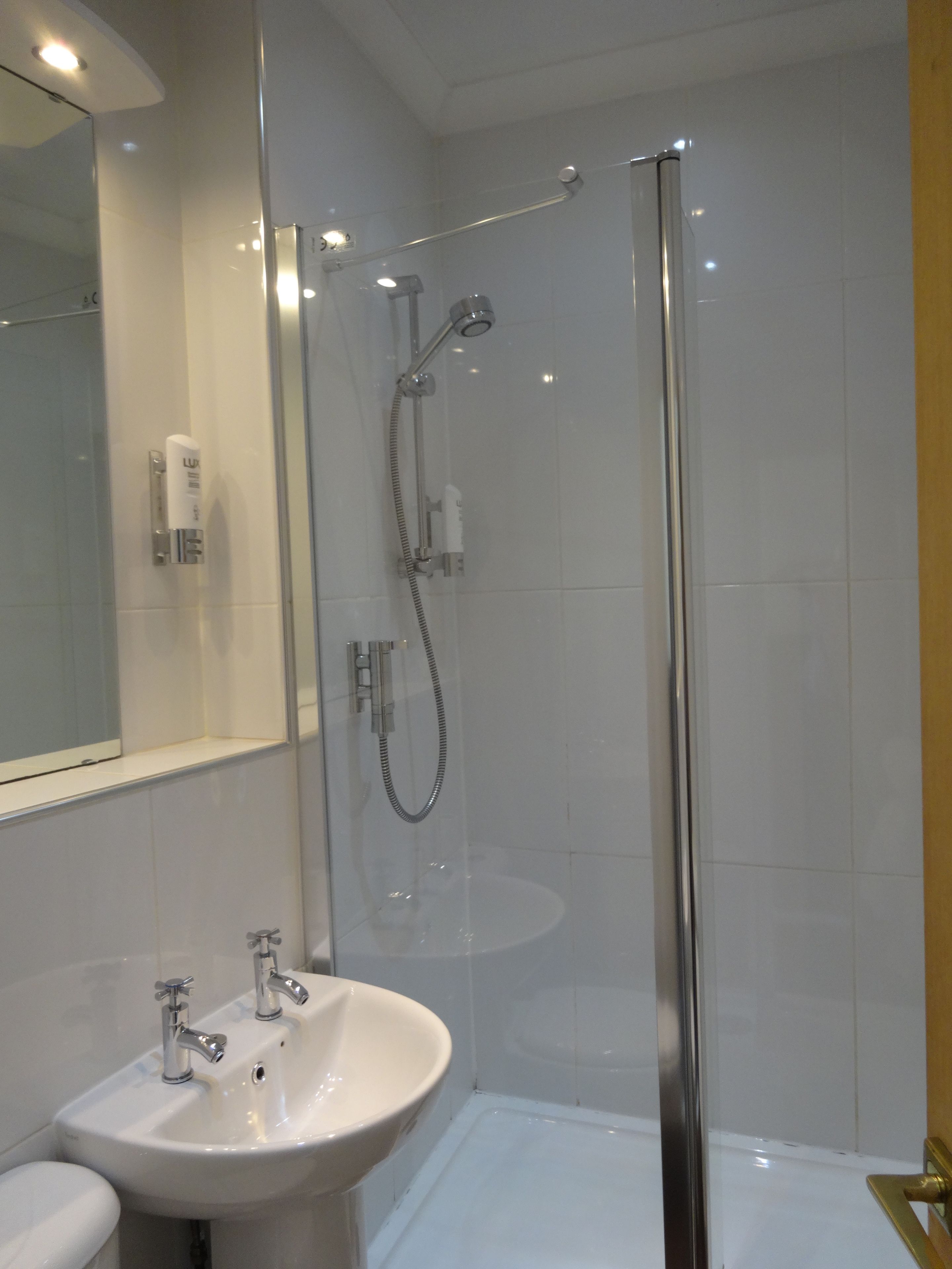 Combined shower/bathtub, free toiletries, hair dryer, bathrobes