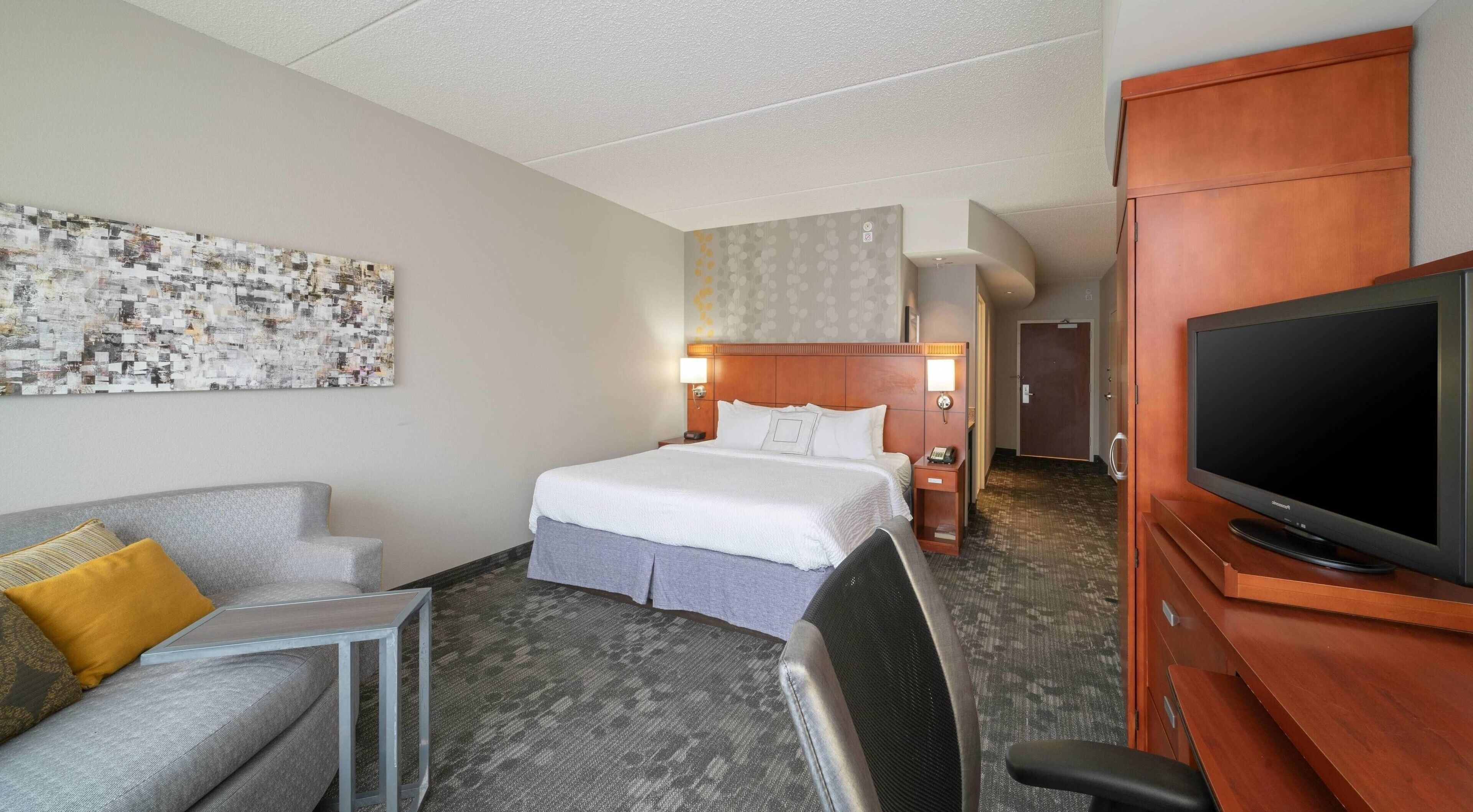 premium bedding, desk, laptop workspace, iron/ironing board