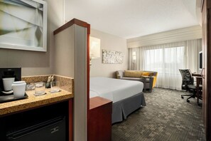 Premium bedding, desk, laptop workspace, iron/ironing board