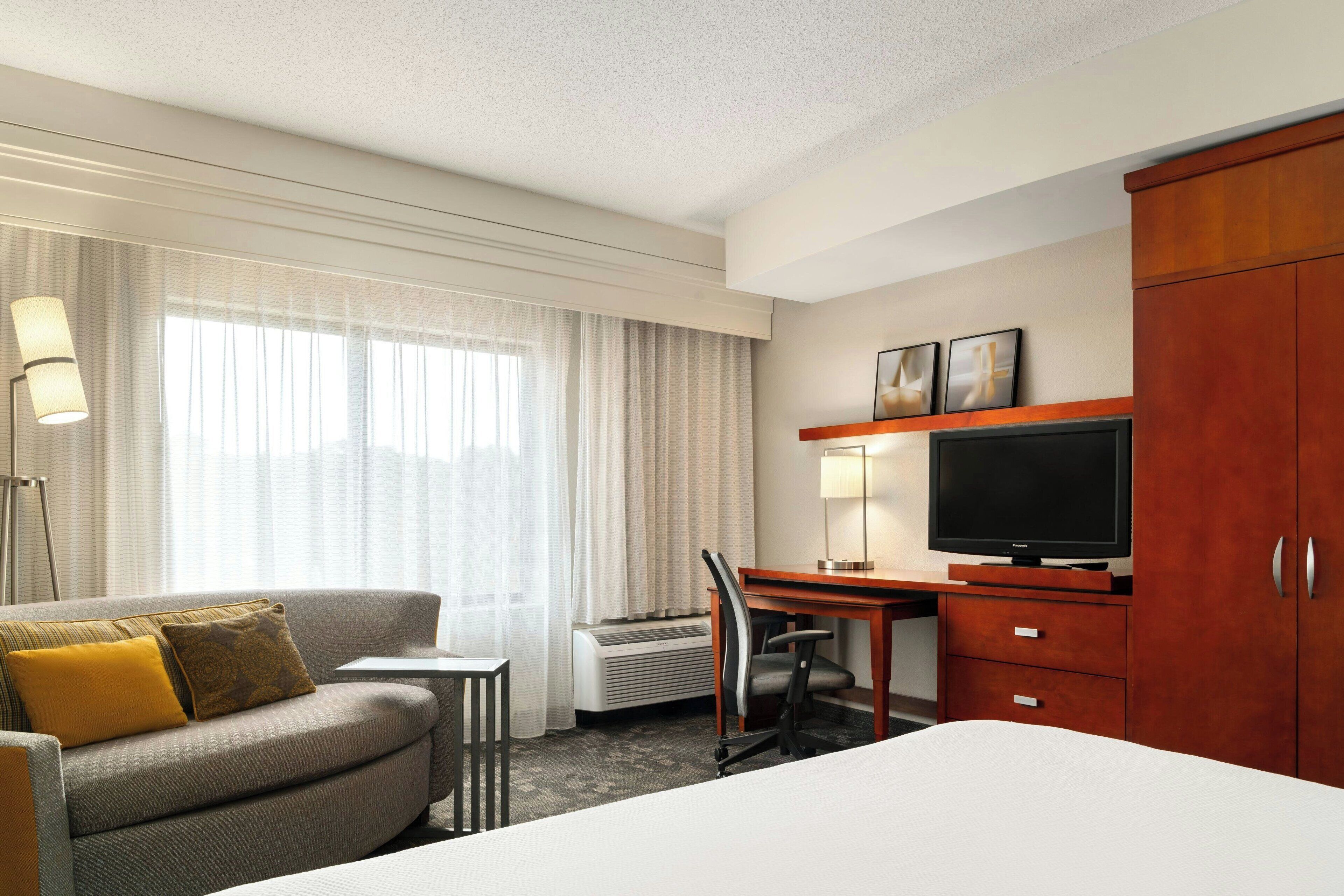 premium bedding, desk, laptop workspace, iron/ironing board