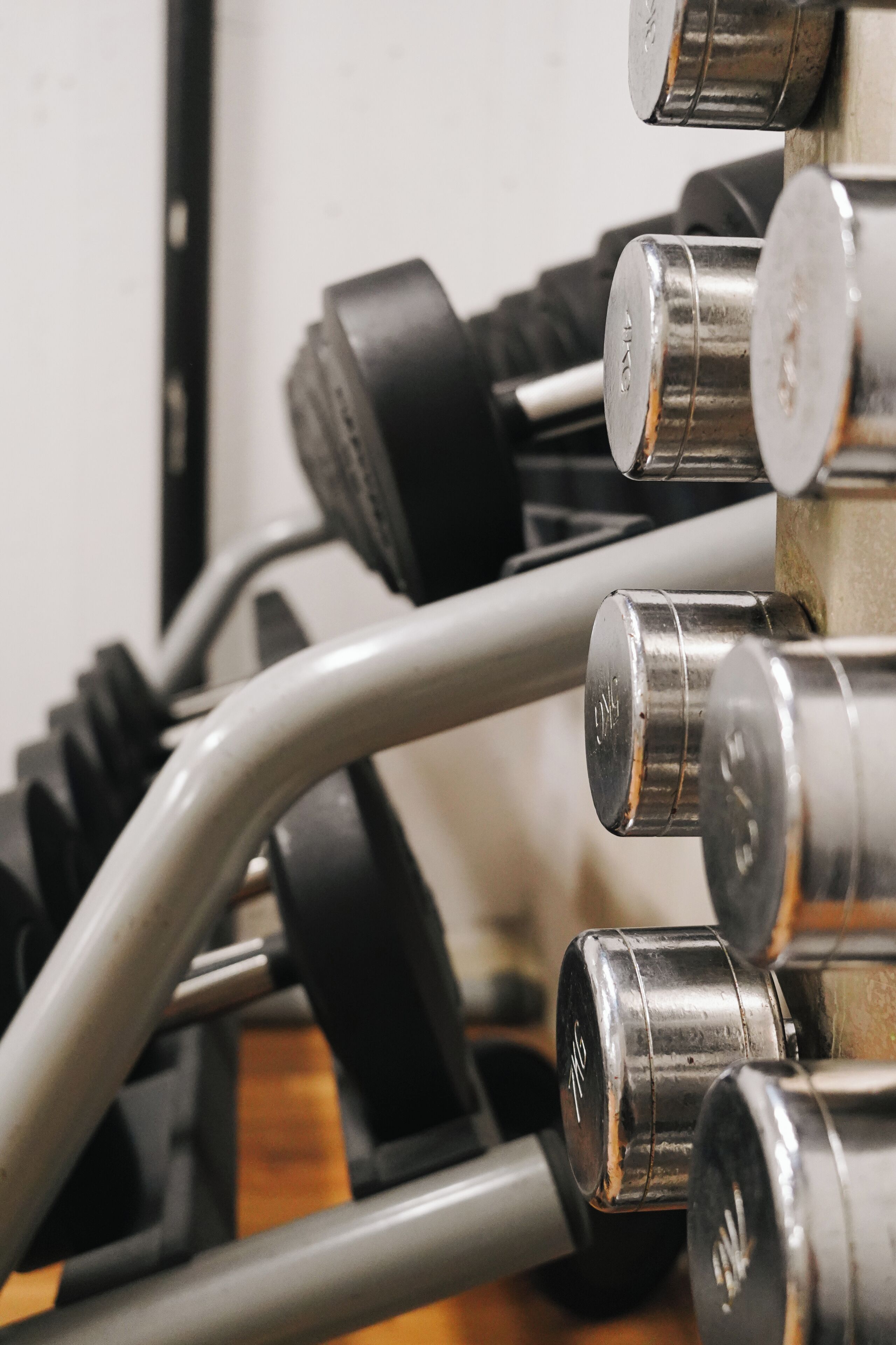 A close-up of a set of dumbbells with visible weight markings.