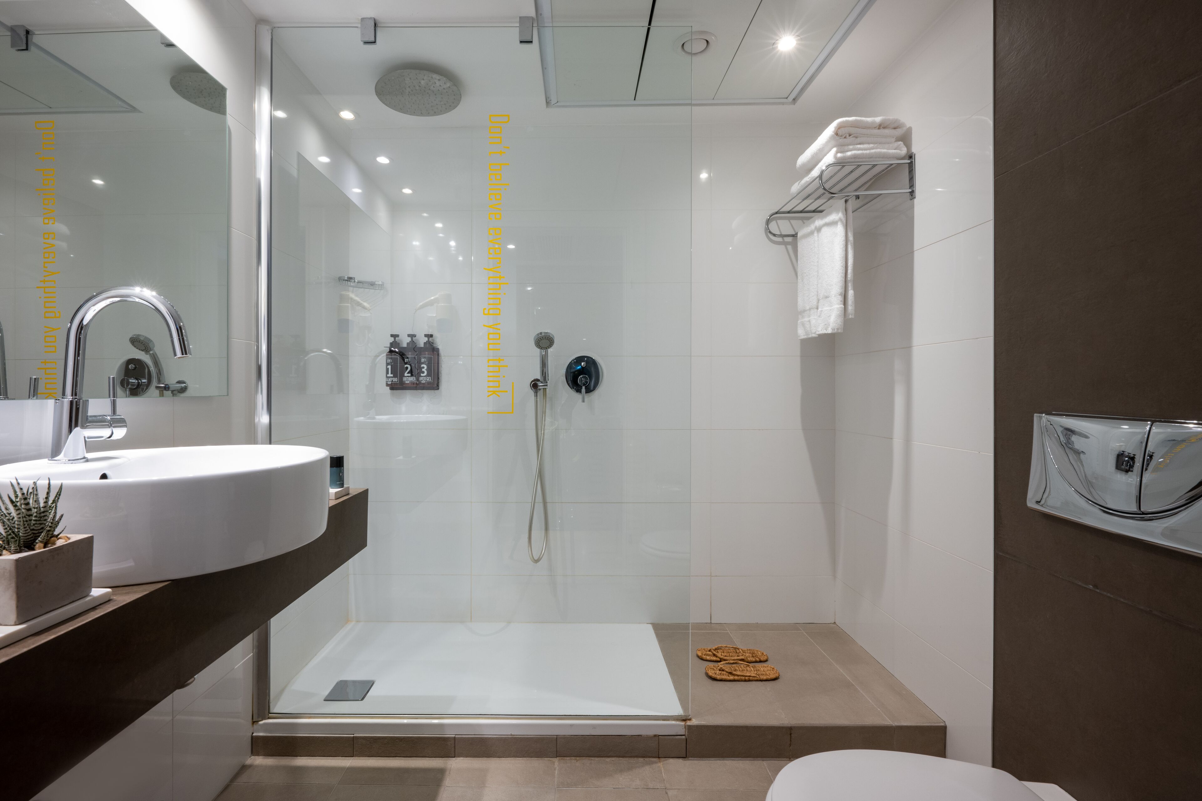 deluxe studio | bathroom | free toiletries, hair dryer, bathrobes, towels