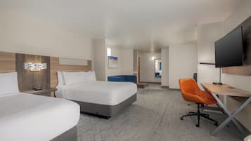 A hotel room with two beds, a desk, a chair, a television, and a painting on the wall.