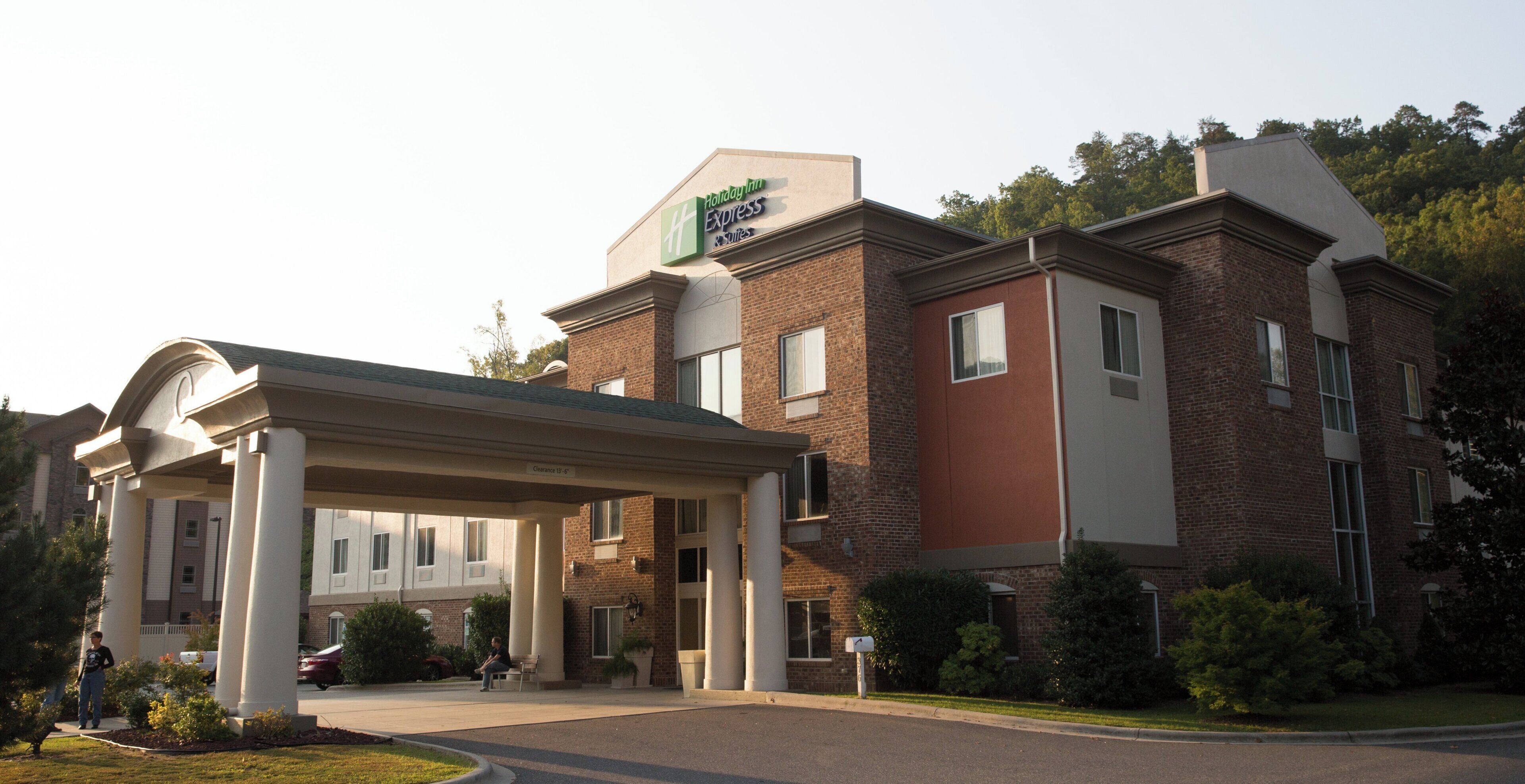 A Holiday Inn Express building with a covered entrance and a brick facade.