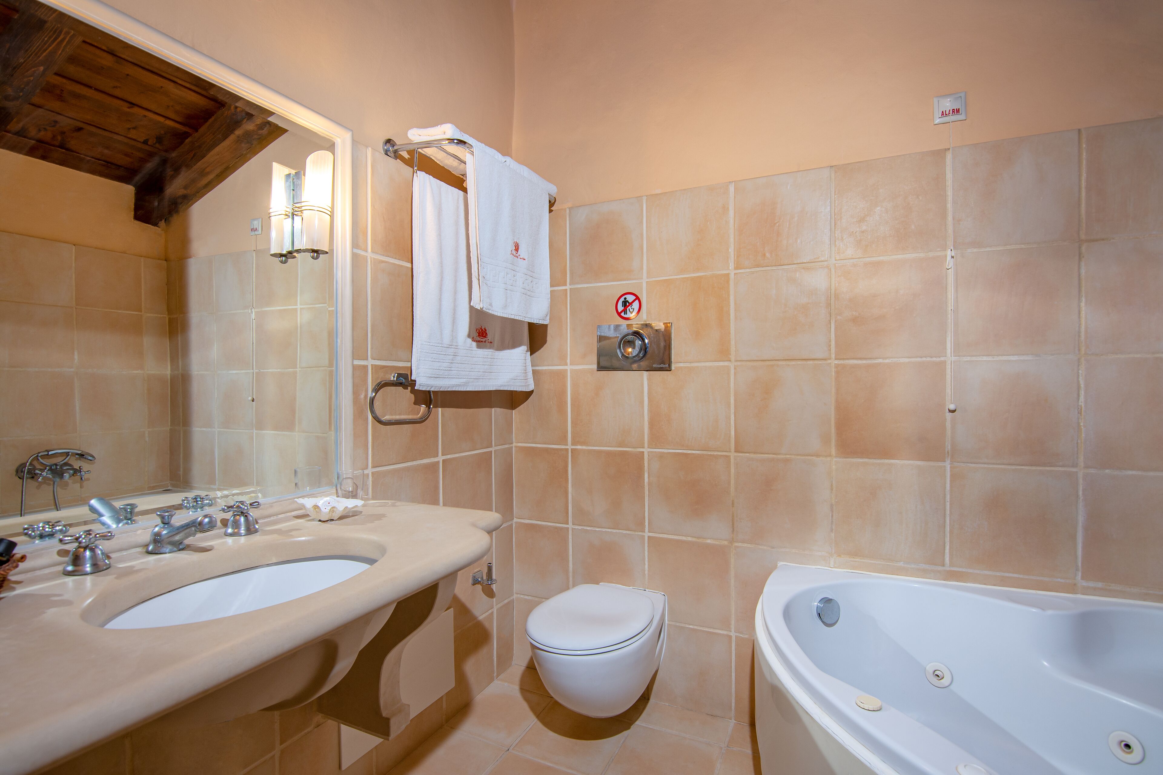 A bathroom with a sink, toilet, and bathtub.