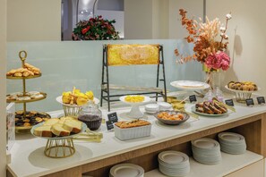 Enjoy a sumptuous buffet spread with a variety of sweet and savory options.