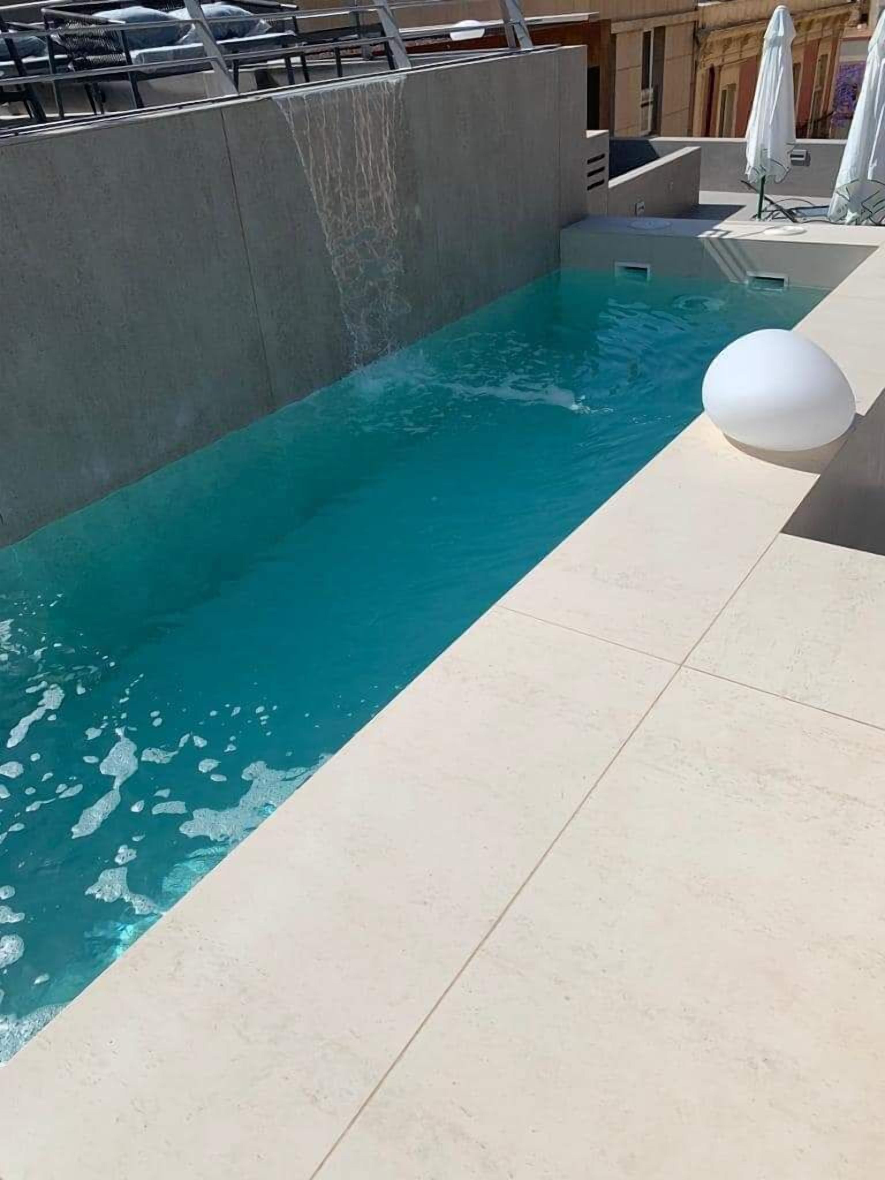 seasonal outdoor pool, open 10:00 am to 7:00 pm, pool umbrellas