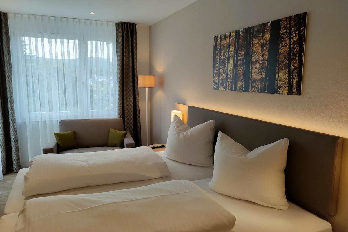 superior plus room  a main building | down duvets, desk, laptop workspace, blackout curtains