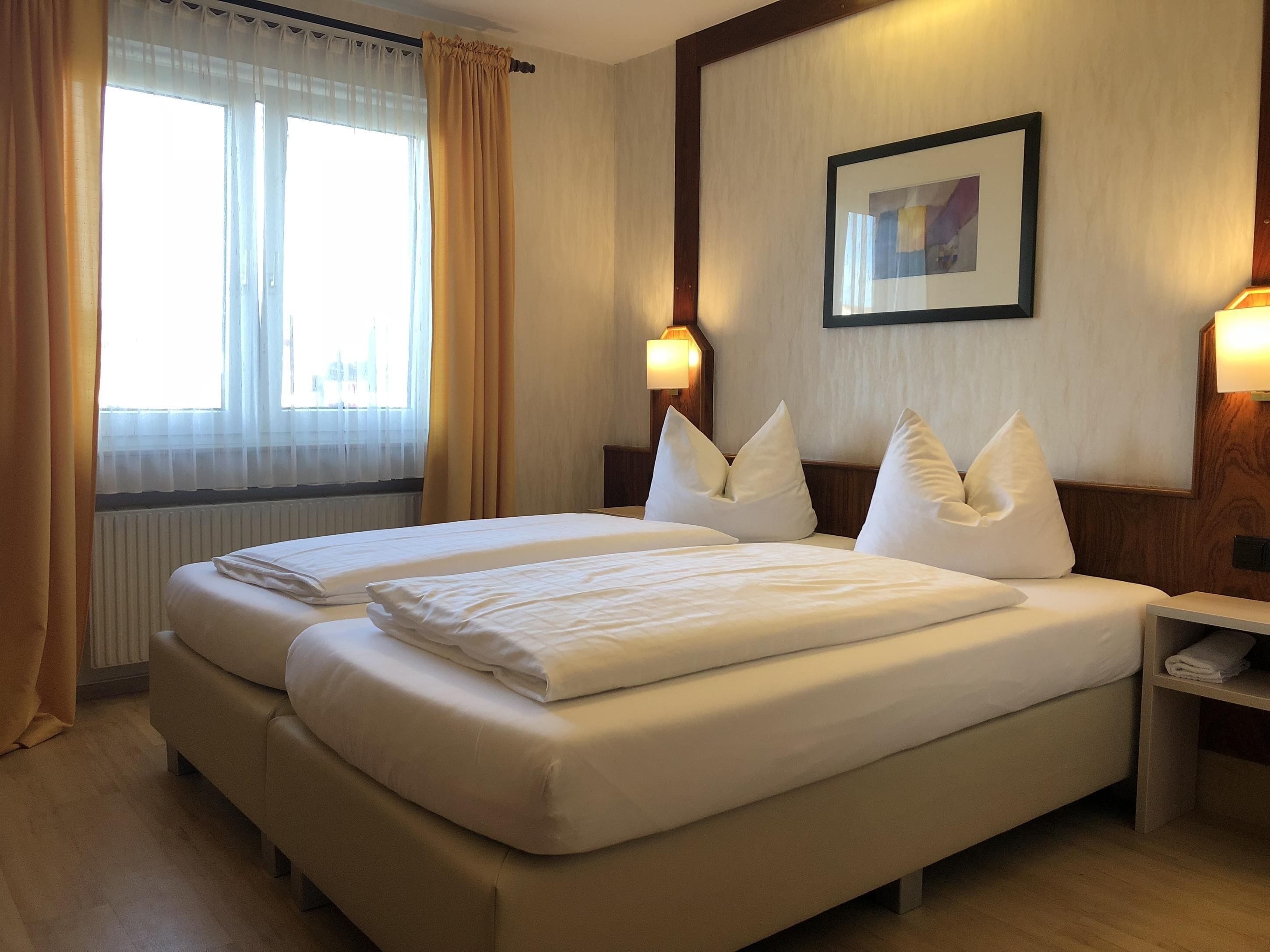 classic room guest house | down duvets, desk, laptop workspace, blackout curtains