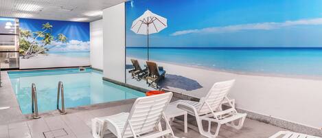 Indoor pool, open 7:00 AM to 10:00 PM, pool loungers