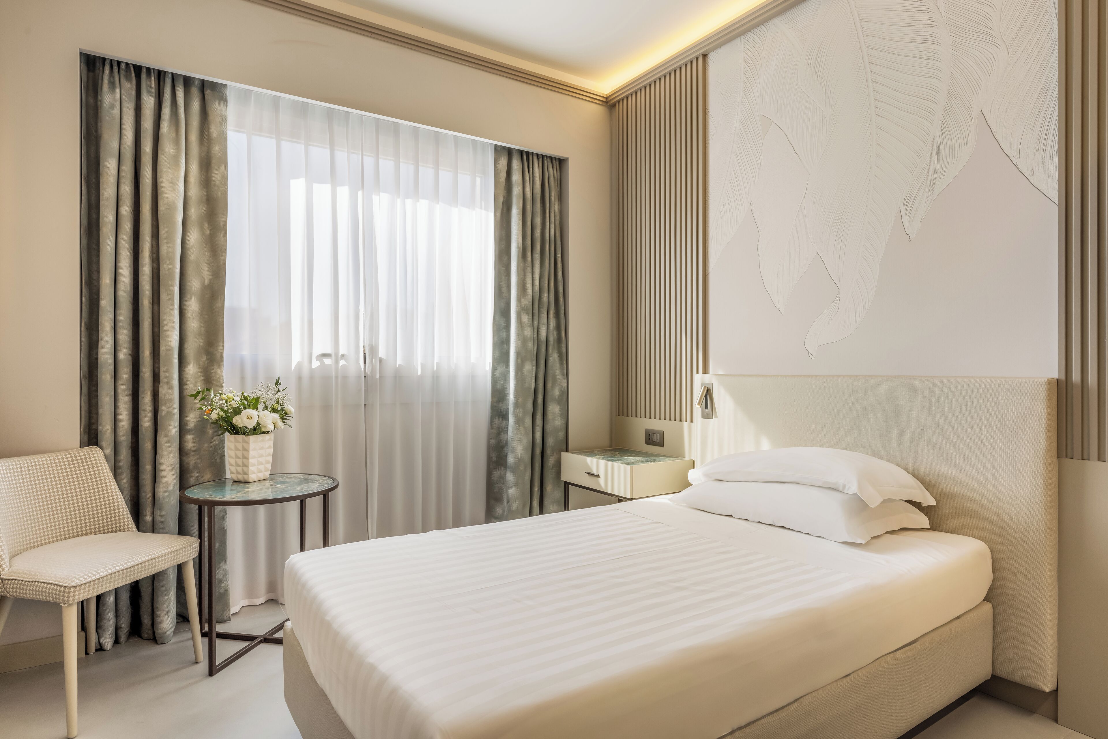 Exclusieve eenpersoonskamer, 1 twijfelaar | Luxe beddengoed, donsdekens, een minibar, een kluis op de kamer