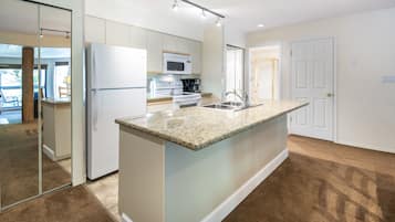 Condo, 2 Bedrooms (Unit 202) | Private kitchen | Full-size fridge, microwave, oven, stovetop
