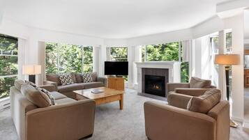 Condo, 2 Bedrooms (Unit 319) | Living area | 52-inch Smart TV with cable channels, fireplace