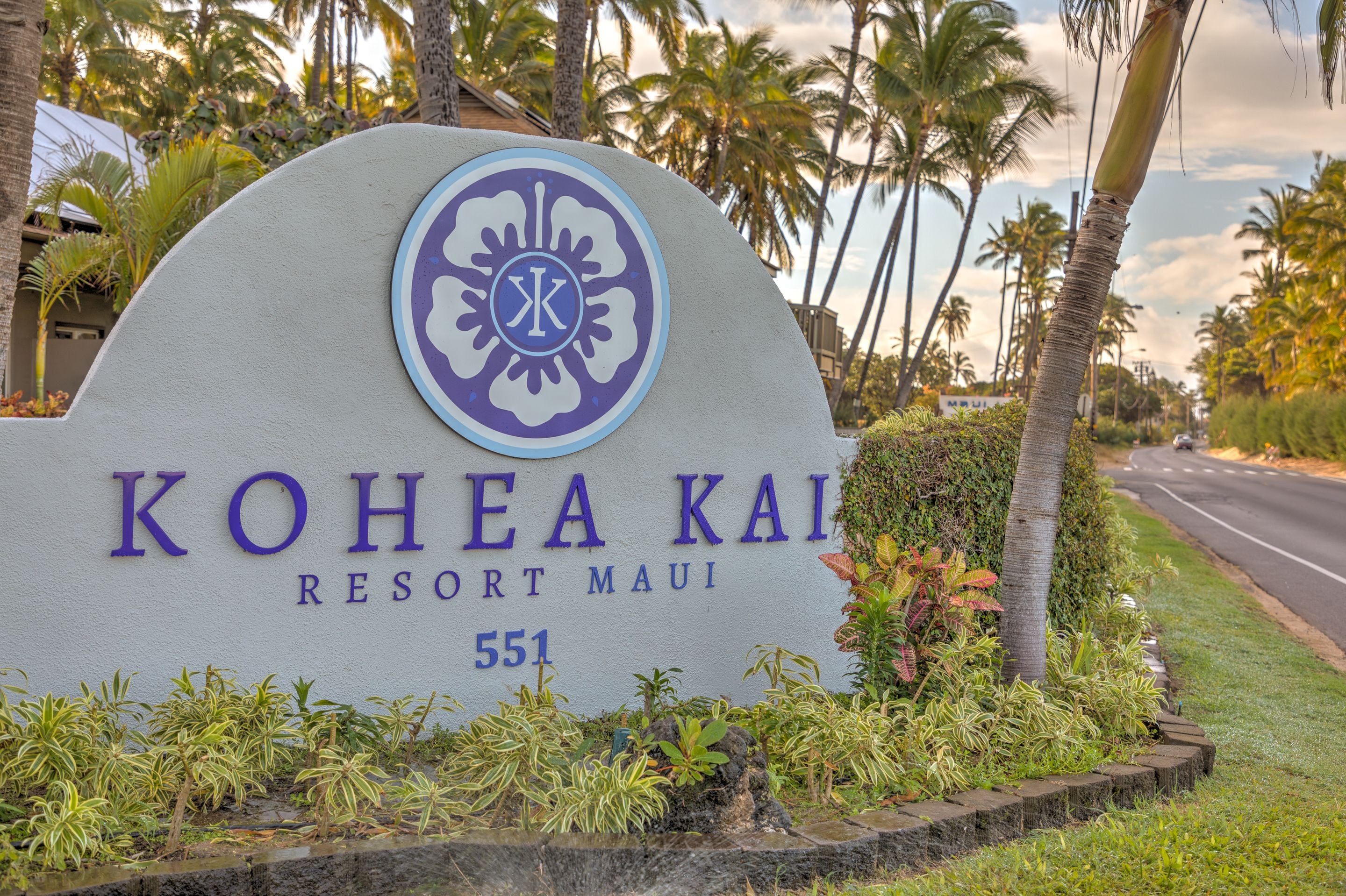 A sign for Kohea Kai Resort Maui with a logo, name, and address.