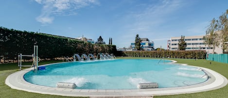 Seasonal outdoor pool, open 10:00 AM to 9:00 PM, pool loungers