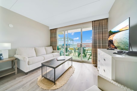 King Room (Patio Level) | In-room safe, bed sheets. Montreal Beach Resort