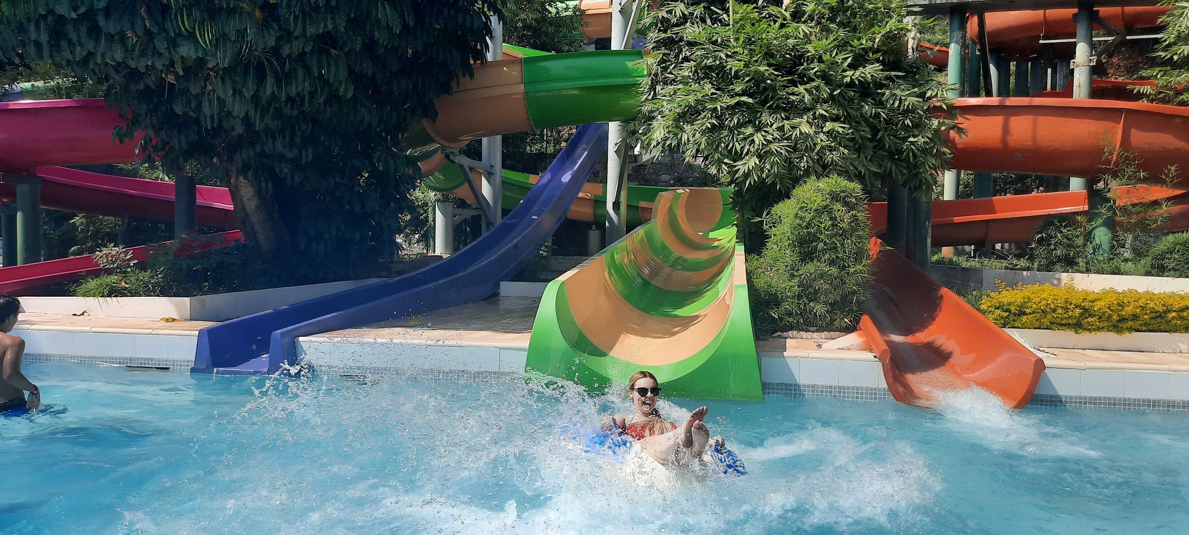 A water park with multiple slides and a pool area.