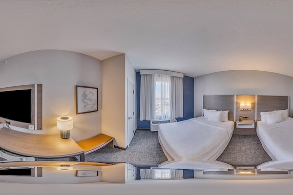 Premium bedding, pillow-top beds, desk, laptop workspace