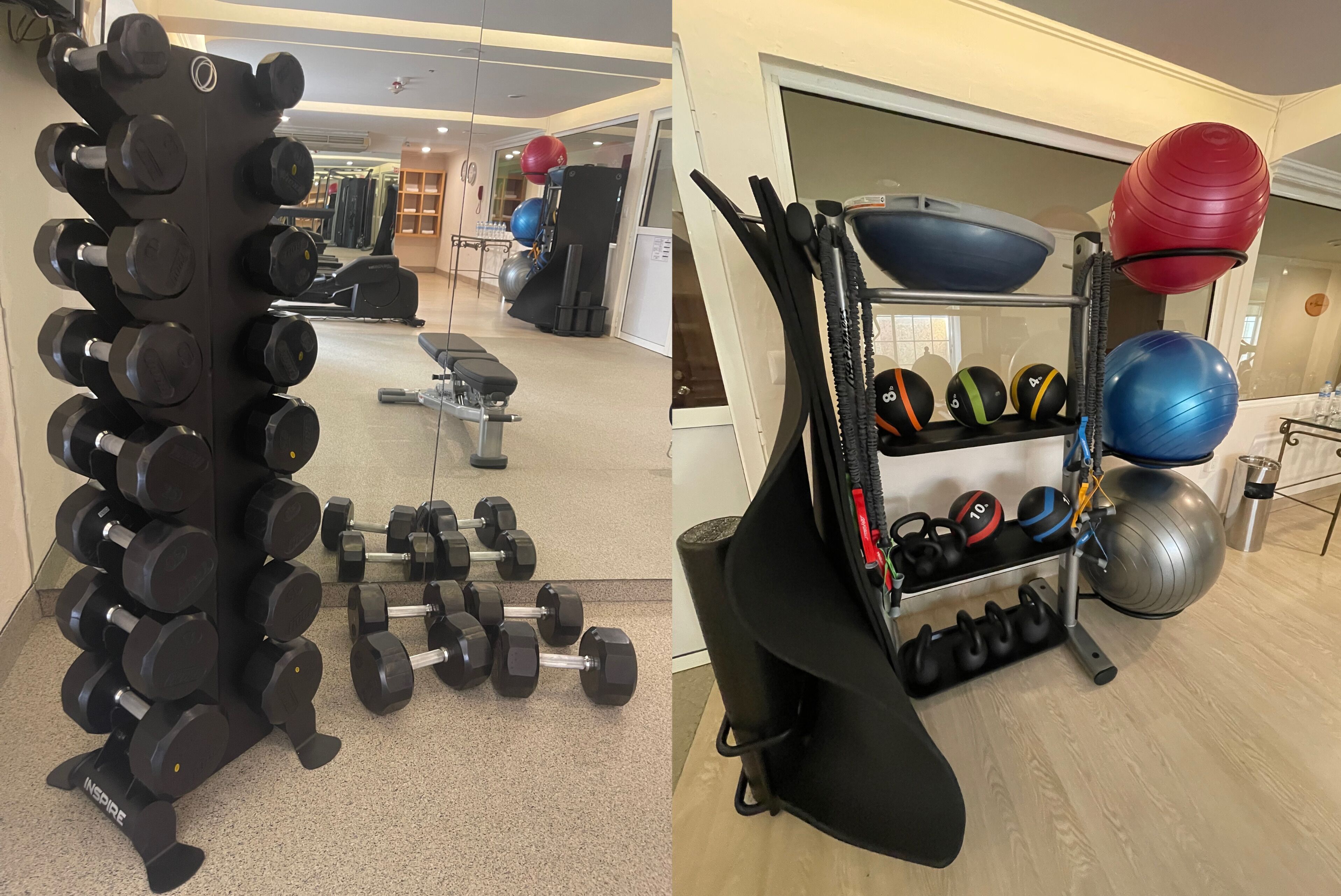 A gym with a rack of dumbbells, kettlebells, and exercise balls.