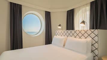 Junior Suite, Sea View | Down comforters, minibar, in-room safe, desk