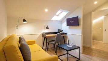 Junior Suite, Sea View | Down duvets, minibar, in-room safe, desk
