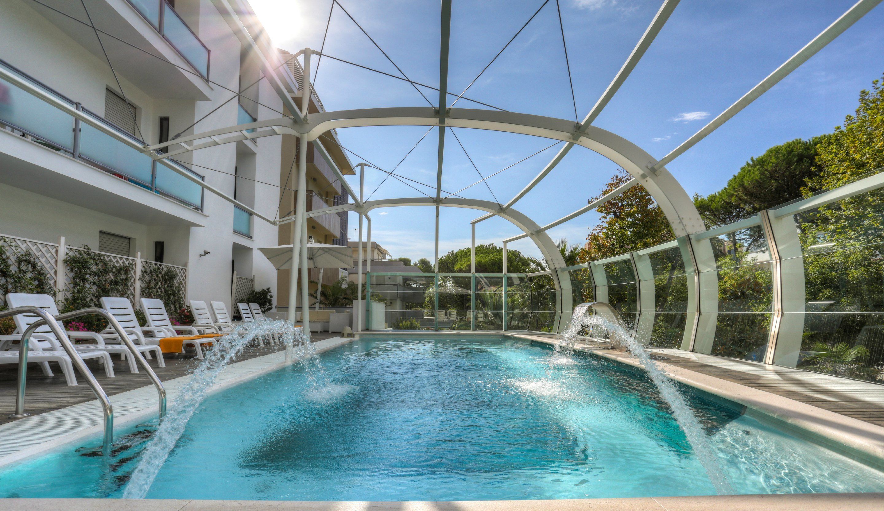 outdoor pool, pool umbrellas, pool loungers