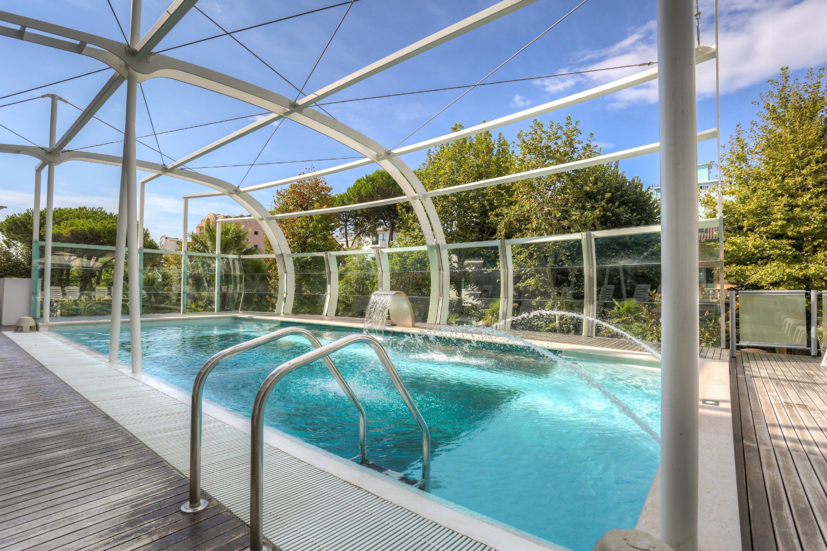 outdoor pool, pool umbrellas, pool loungers