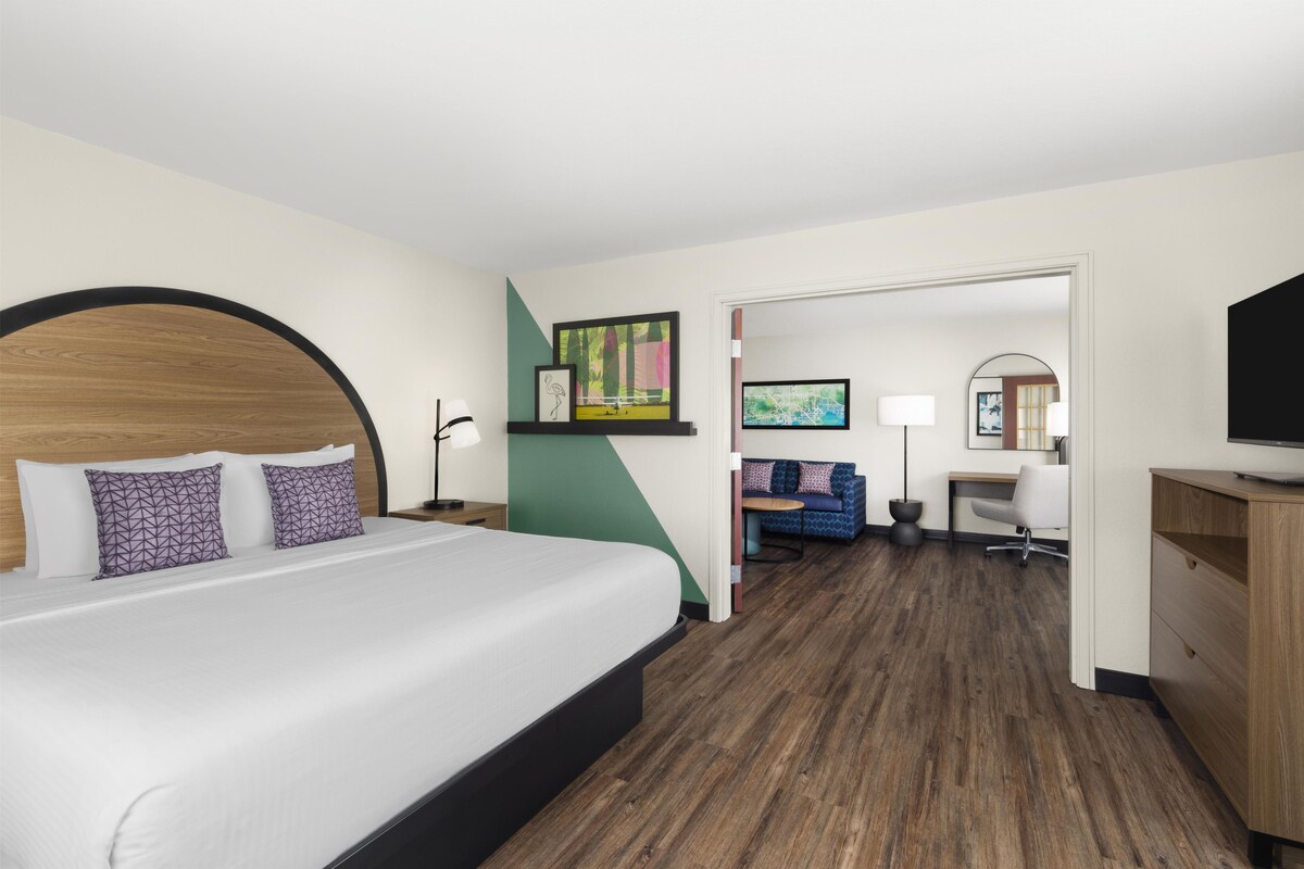 Suite, 1 King Bed, Non Smoking | Desk, laptop workspace, blackout drapes, iron/ironing board