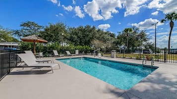 Outdoor pool, open 7:00 AM to 9:00 PM, pool loungers