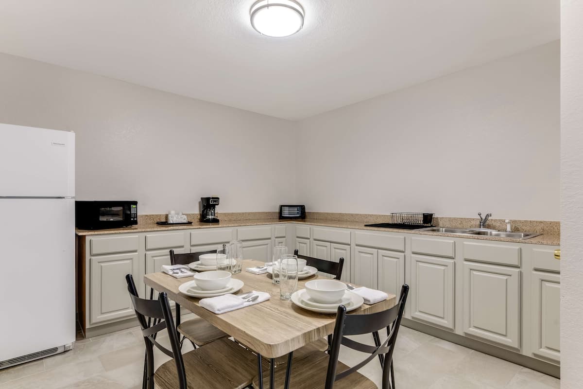 suite, 1 king bed, non smoking (dining and kitchen area) | 1 bedroom, desk, laptop workspace, blackout curtains