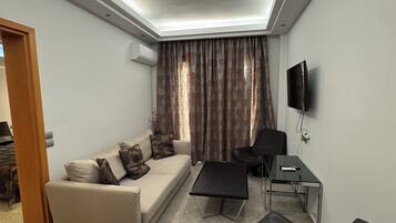Suite, Sea View | Living area | LCD TV