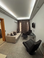 Suite, Sea View | Living area | LCD TV