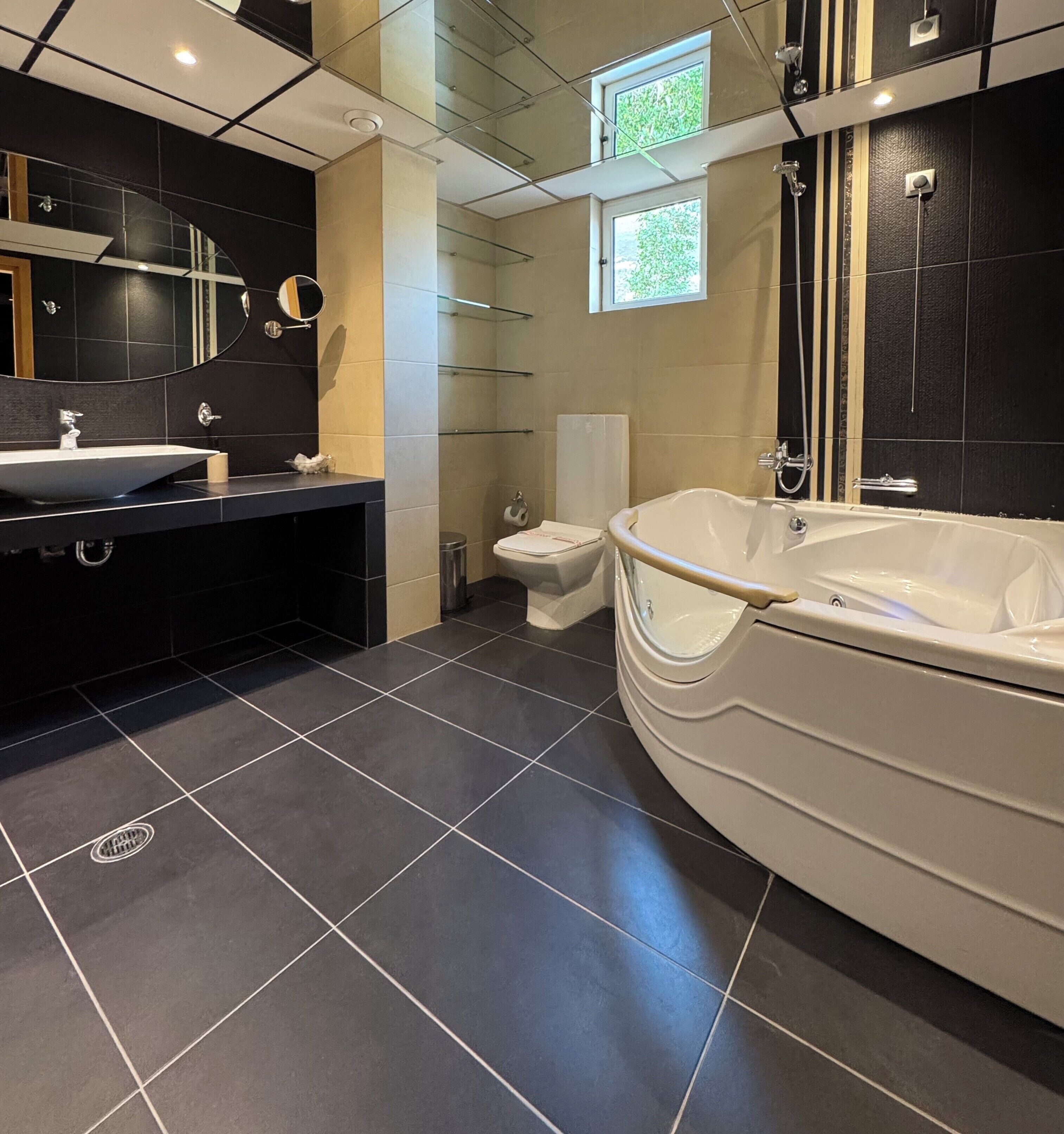 suite, sea view | bathroom | shower, free toiletries, hair dryer, towels