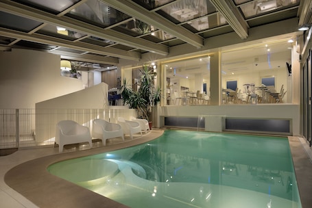 Indoor pool, seasonal outdoor pool, pool umbrellas, sun loungers