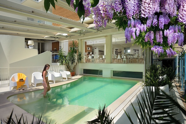Indoor pool, seasonal outdoor pool, pool umbrellas, sun loungers