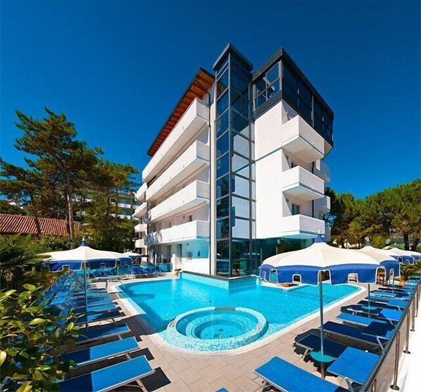 Outdoor pool, open 8:00 AM to midnight, pool umbrellas, pool loungers