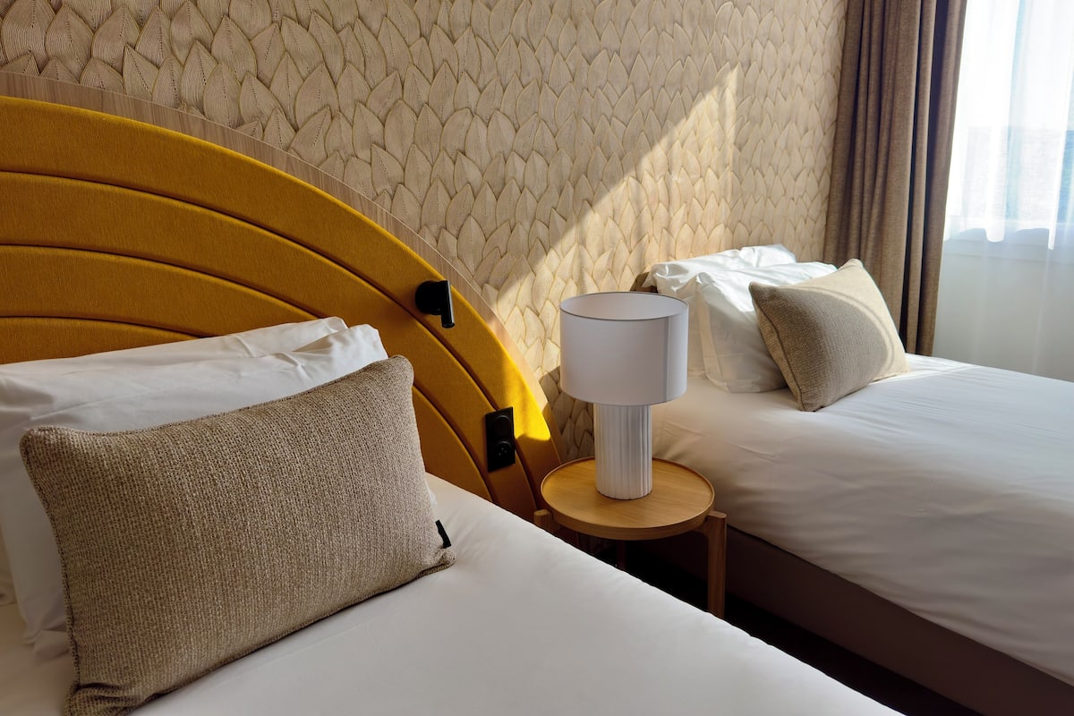 Premium bedding, desk, laptop workspace, soundproofing