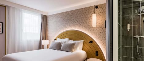 Premium bedding, desk, laptop workspace, soundproofing